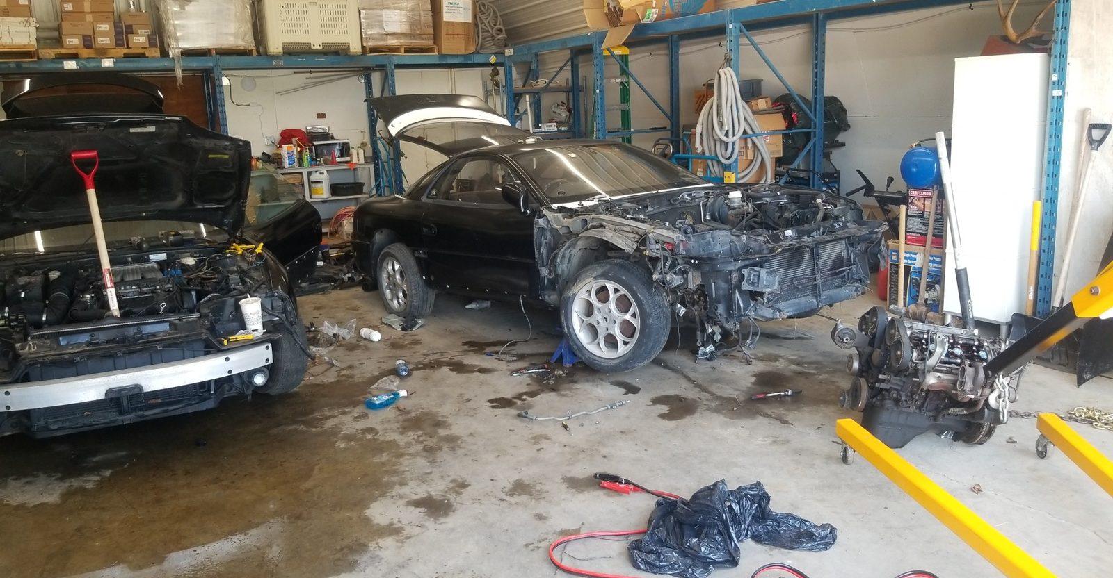 3000GT chassis and engine on stands mid-swap