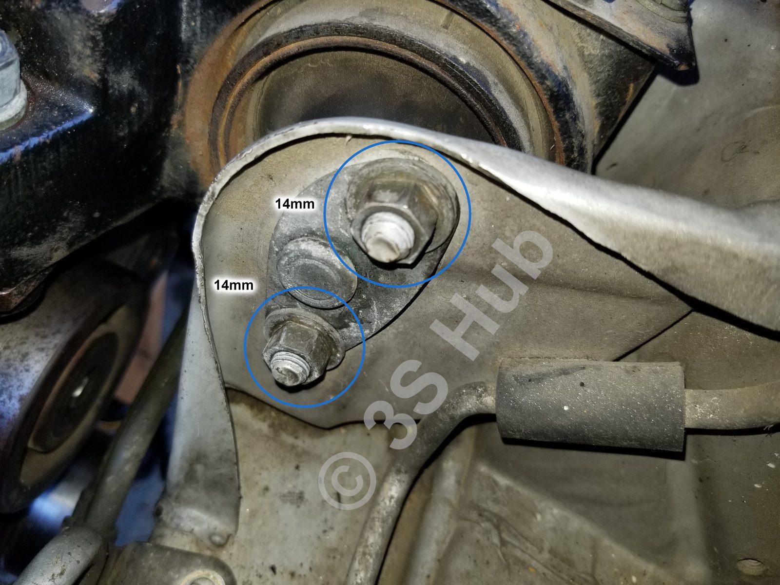 Timing-system bolts circled on a 6G72 engine